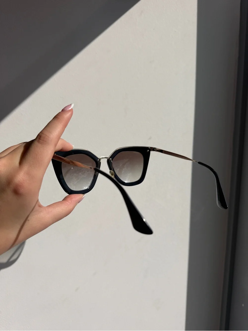 Prada Black Cat-Eye Sunglasses with Gradient Lenses